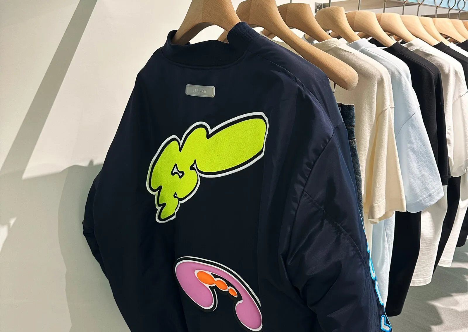 The Flâneur SS26 bomber jacket with a graphic inspired by London