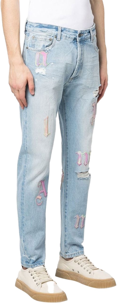 Palm Angels ripped embroidered tapered jeans Blauw