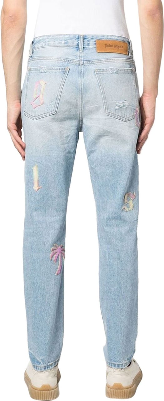Palm Angels ripped embroidered tapered jeans Blauw