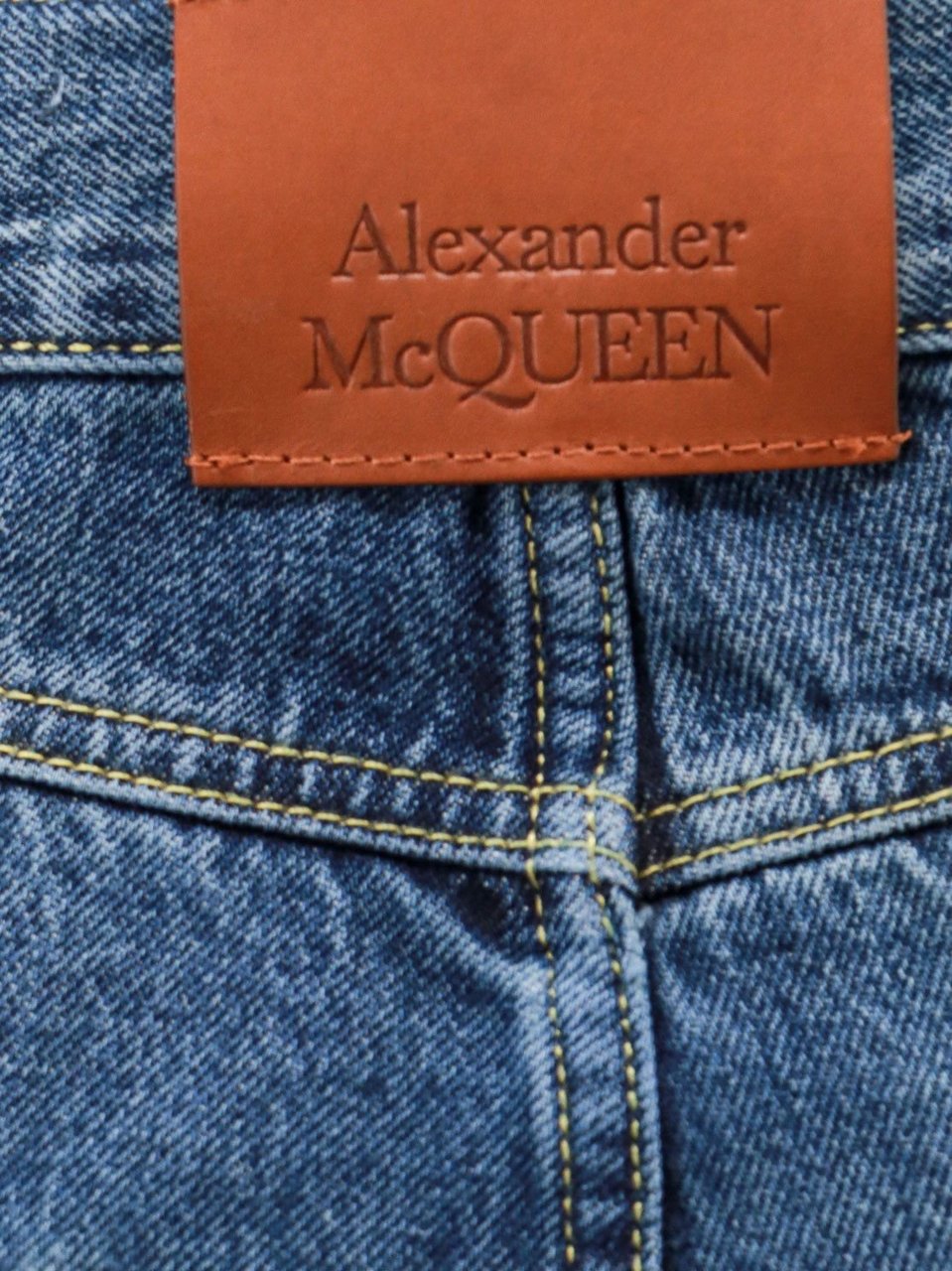 Alexander McQueen Cotton jeans with leather logo patch Blauw
