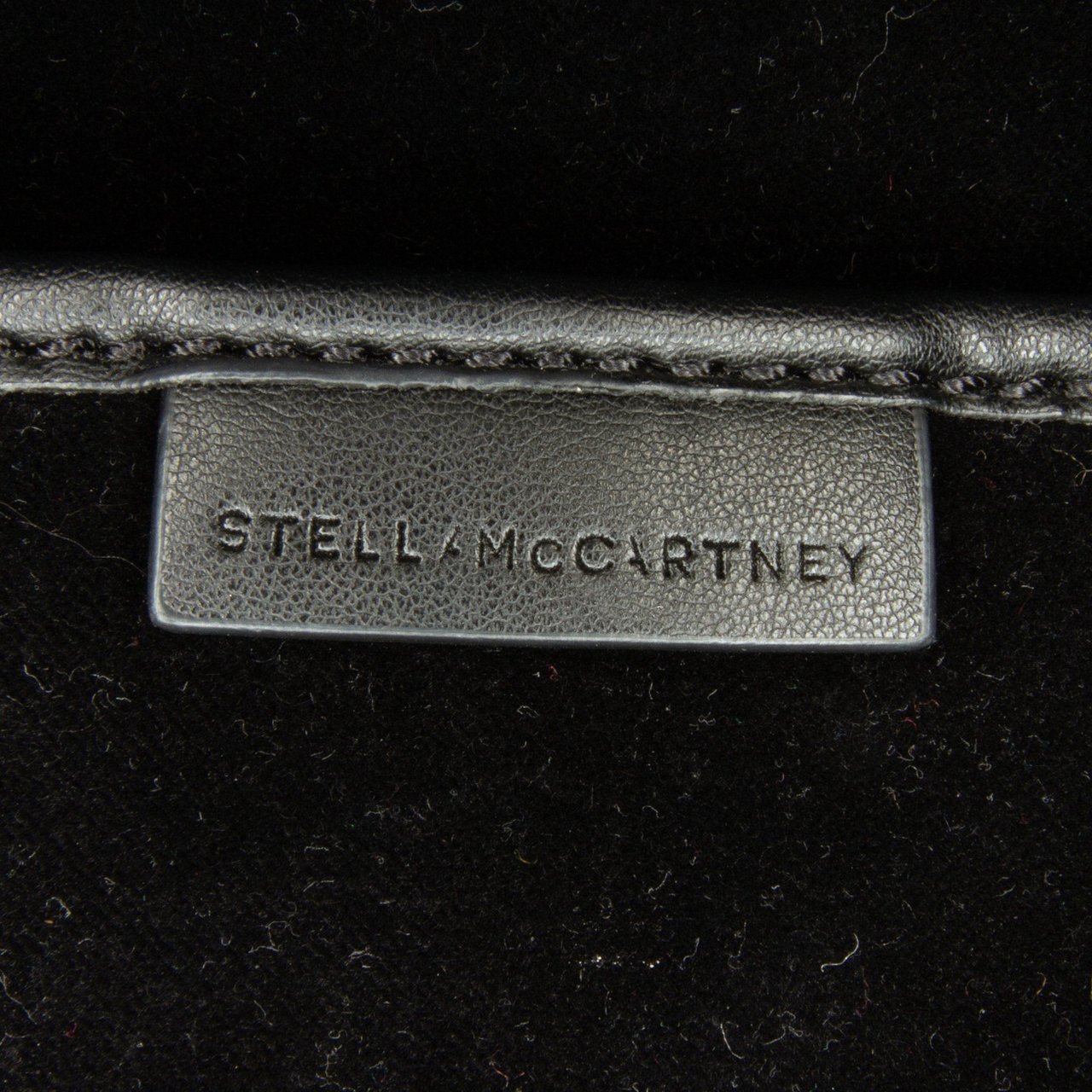 Stella McCartney Mini Crystal Monogram Round Crossbody Zwart