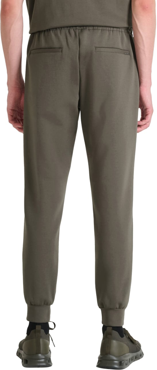 Antony Morato FLEECE TROUSERS CARROT FIT IN INTERLOCK COTTON BLEND FABRIC WITH LOGOED METAL BADGE Groen