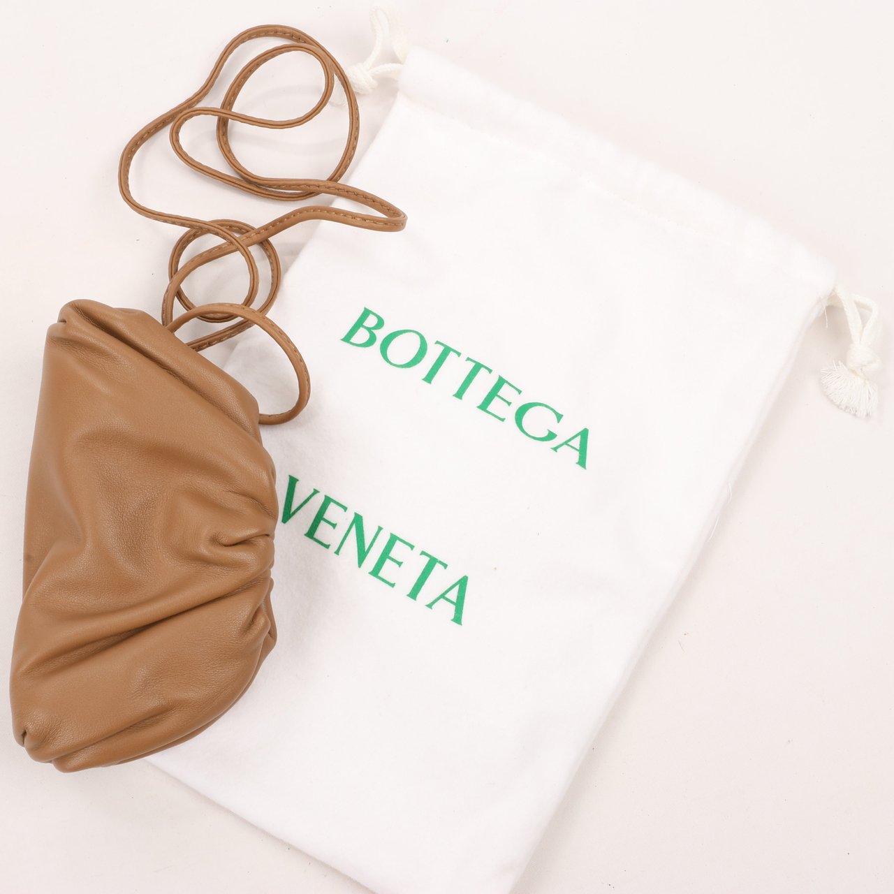 Bottega Veneta Bottega Veneta Micro The Pouch Leather Crossbody bag in Almond Bruin