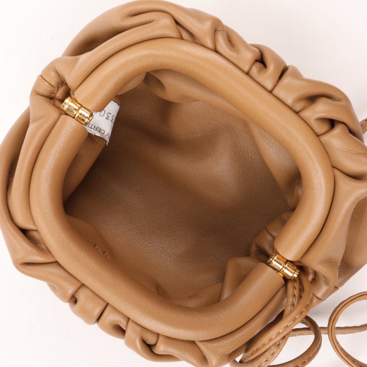 Bottega Veneta Bottega Veneta Micro The Pouch Leather Crossbody bag in Almond Bruin