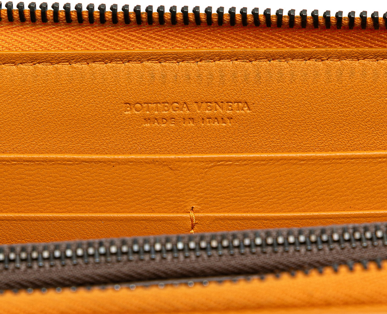 Bottega Veneta Leather Intrecciato Zip Around Wallet Oranje