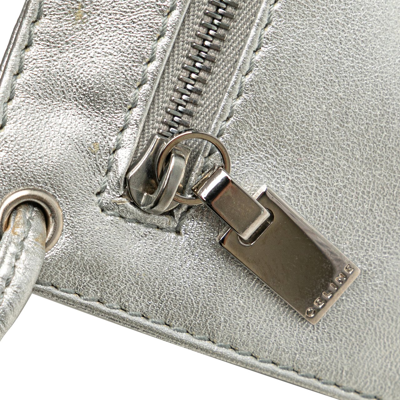 Celine Perforated Metallic Calfskin Sling Backpack Zilver