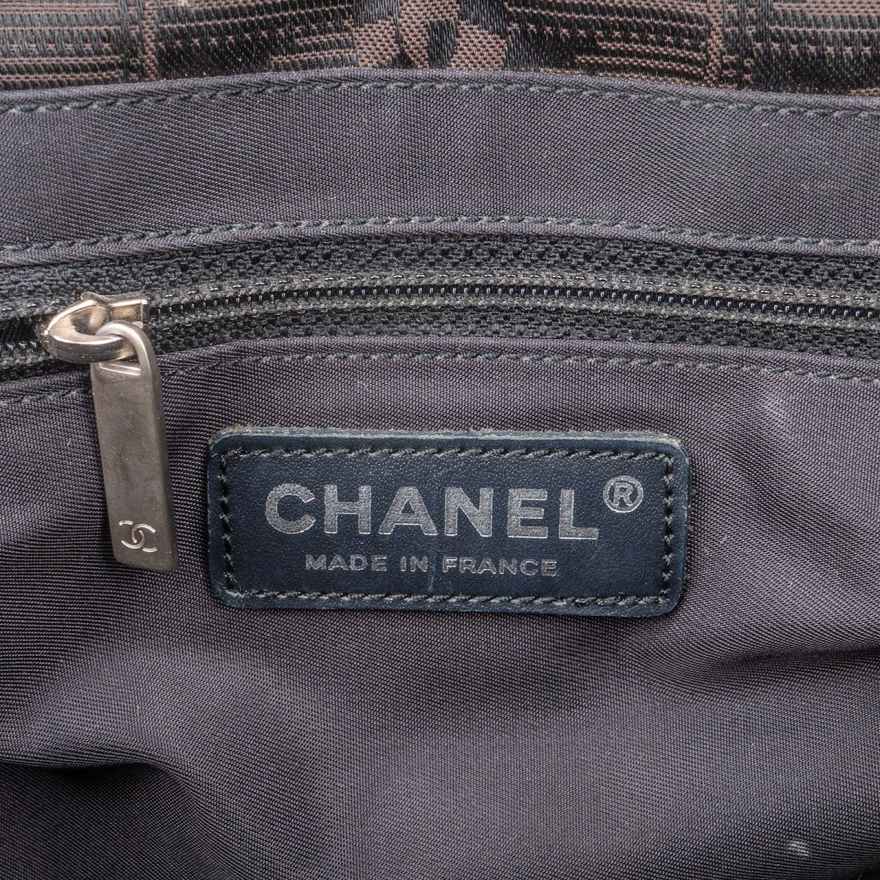Chanel Chanel Monogram Travel Line Handbag Bruin