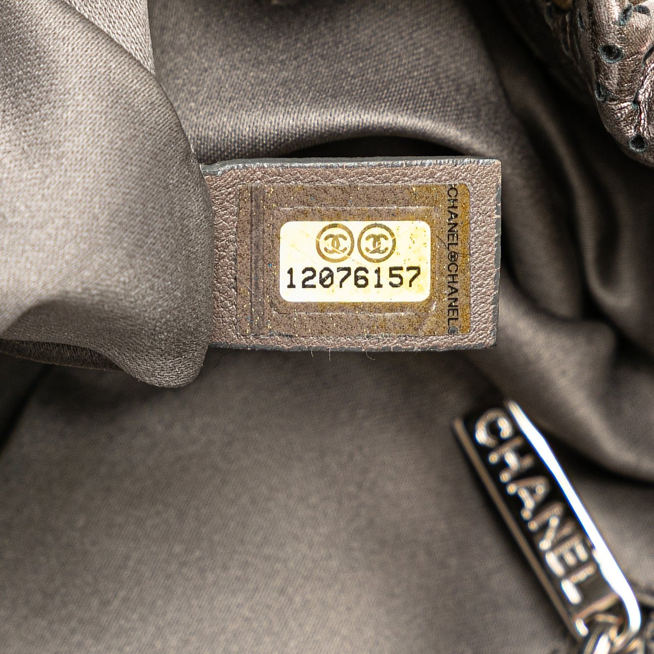 Chanel Metallic Perforated Calfskin Drill Accordion Flap Zilver