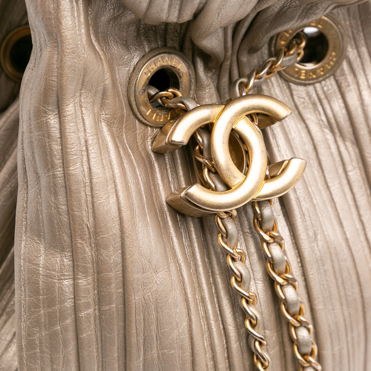 Chanel Small Metallic Calfskin Coco Pleats Drawstring Backpack Goud