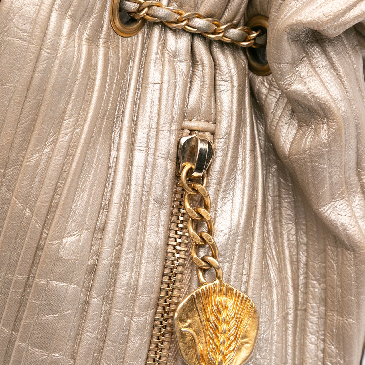 Chanel Small Metallic Calfskin Coco Pleats Drawstring Backpack Goud