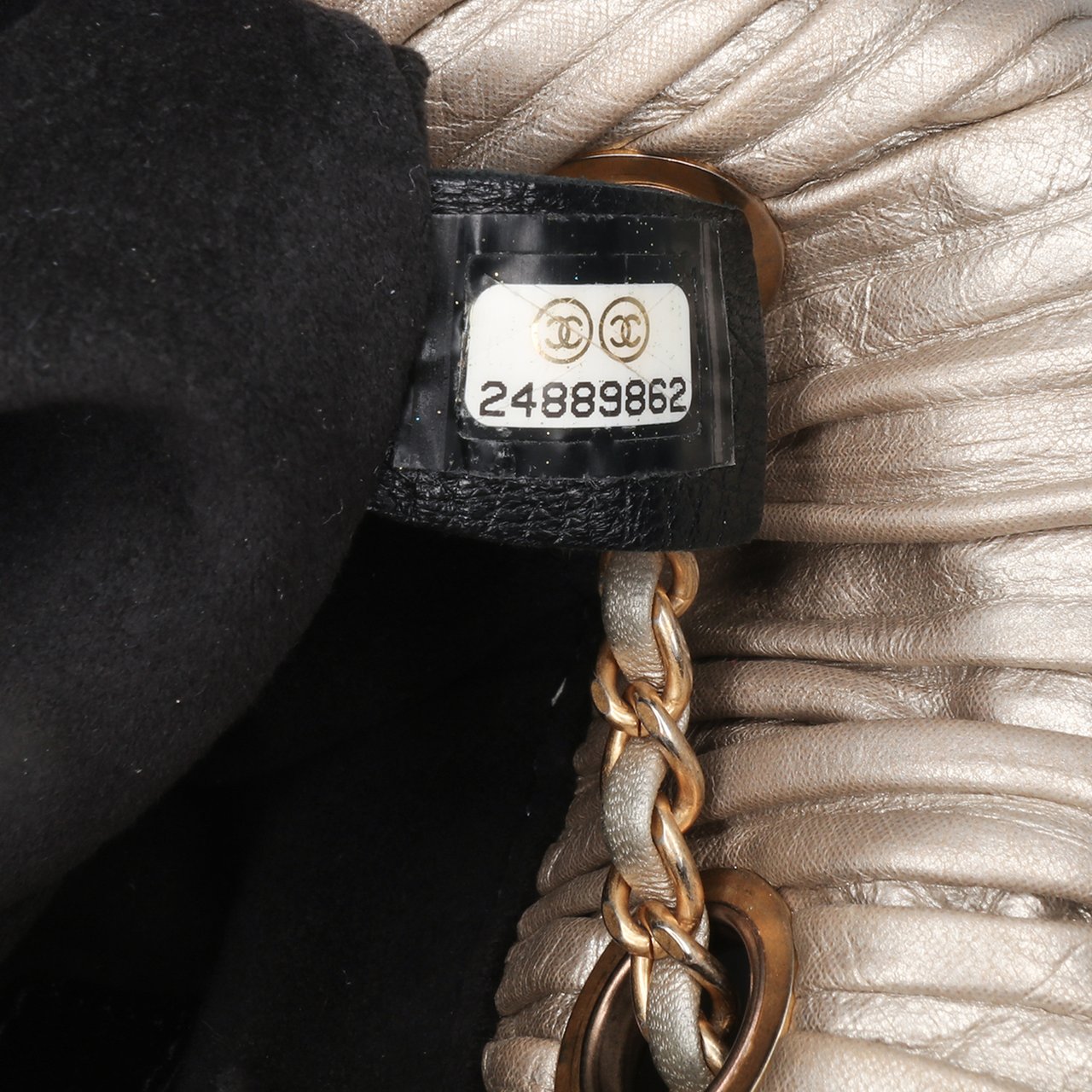Chanel Small Metallic Calfskin Coco Pleats Drawstring Backpack Goud