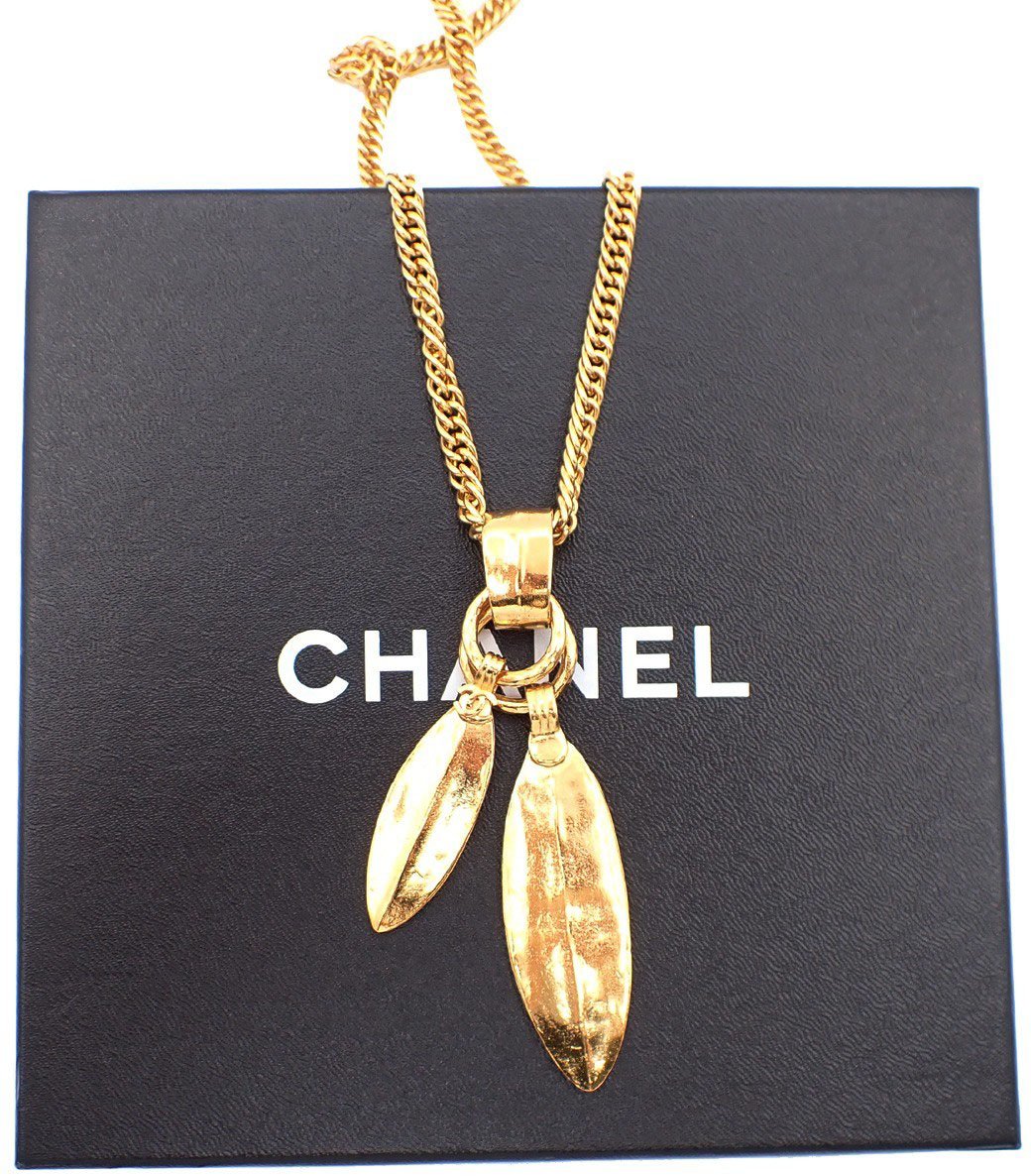 Chanel Chanel Feather CC Pendant Necklace Metal with Faux Pearl and Crystal Goud