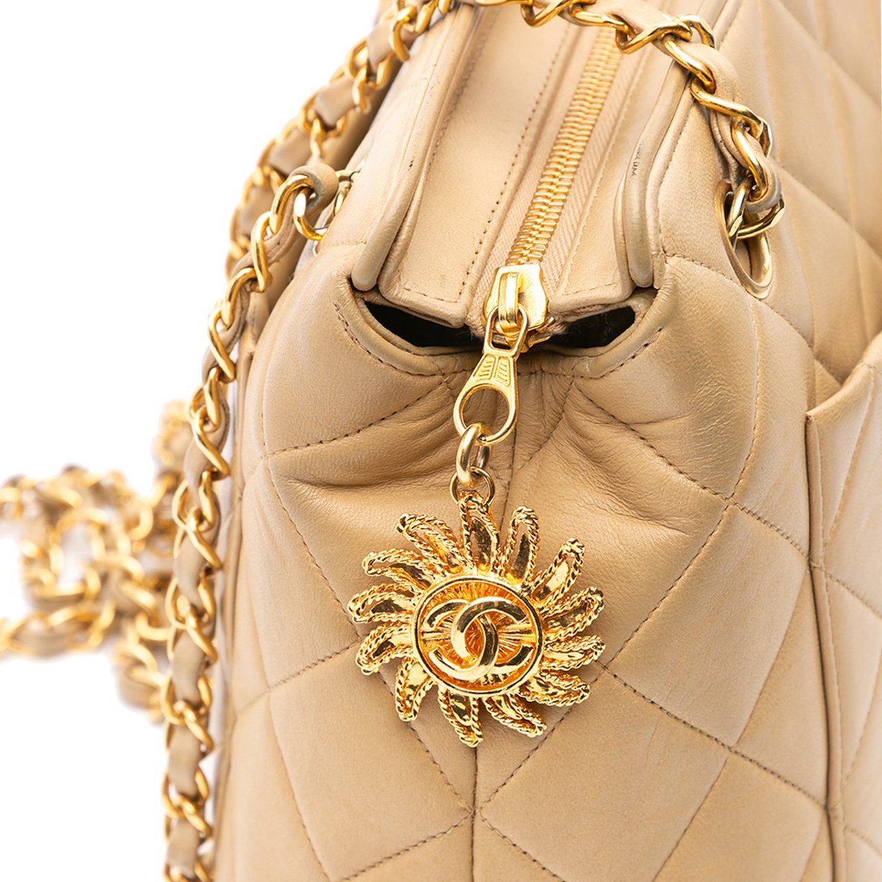 Chanel Quilted Lambskin Sun Charm Chain Crossbody Bruin