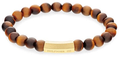 Tommy Hilfiger Tommy Hilfiger Jewels TJ2790582 Armband Heren Tigers Eye 18cm Deze armband van Tommy Hilfiger uit de jewelry serie met nr: TJ2790582 is een opvallend model. De heren armband heeft bruine tijgeroog kralen geregen op elastiek draad. Tussen de Bruin