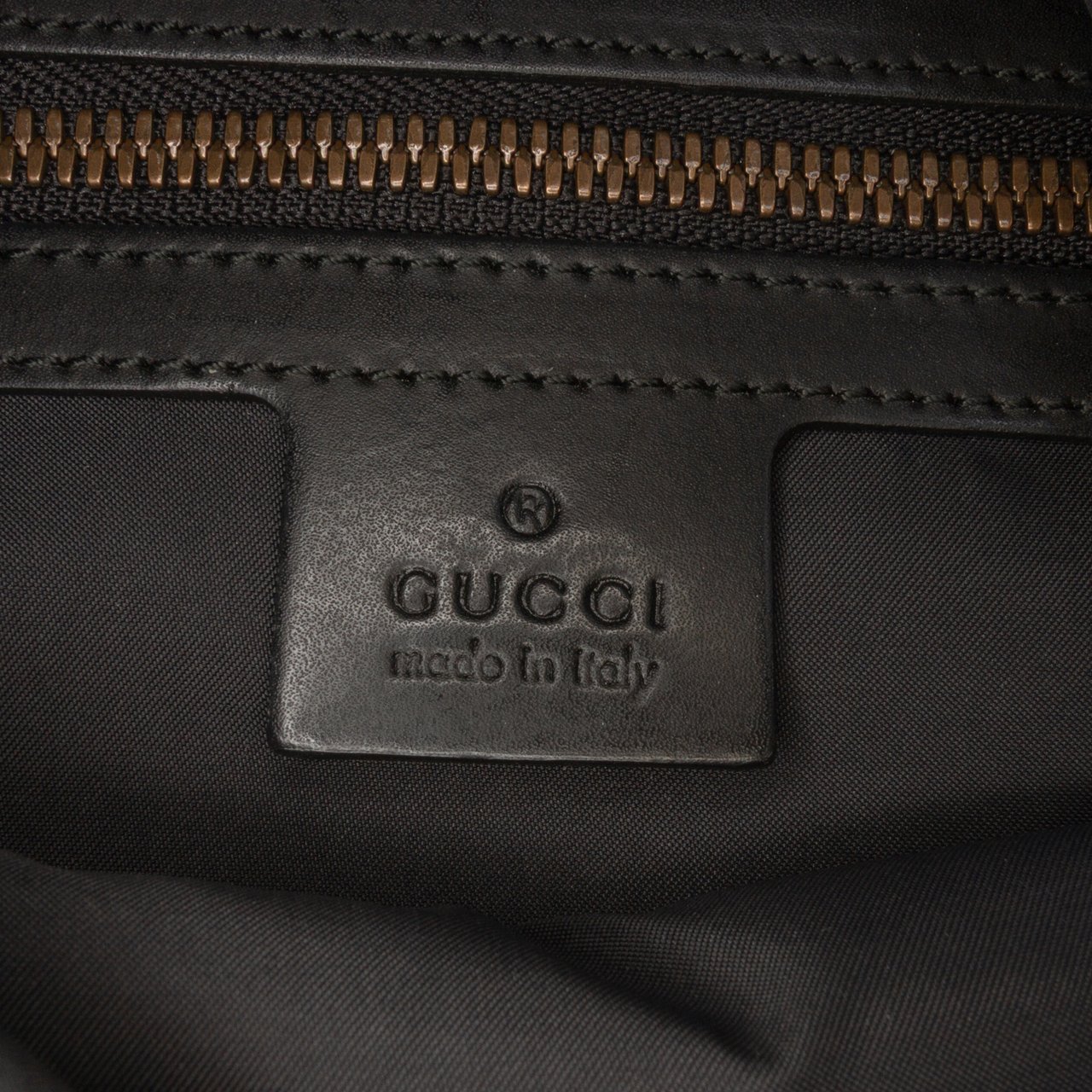 Gucci GG Supreme Angry Cat Drawstring Backpack Bruin