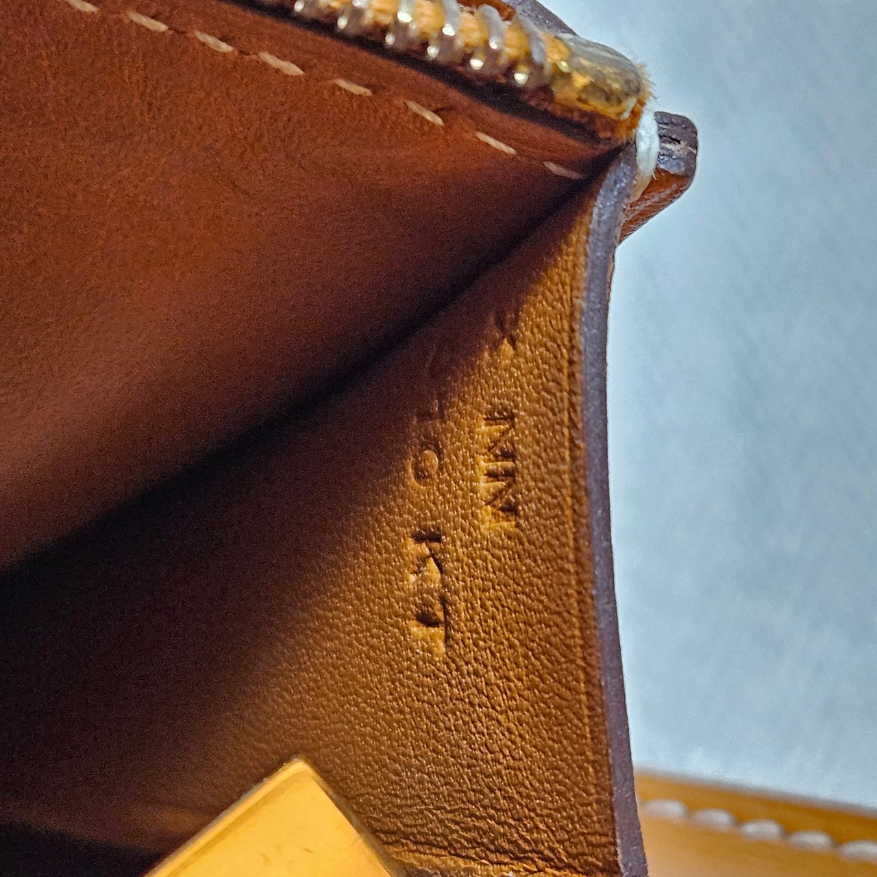 Hermès Hermès Natural Leather Compact Constance Wallet Bruin