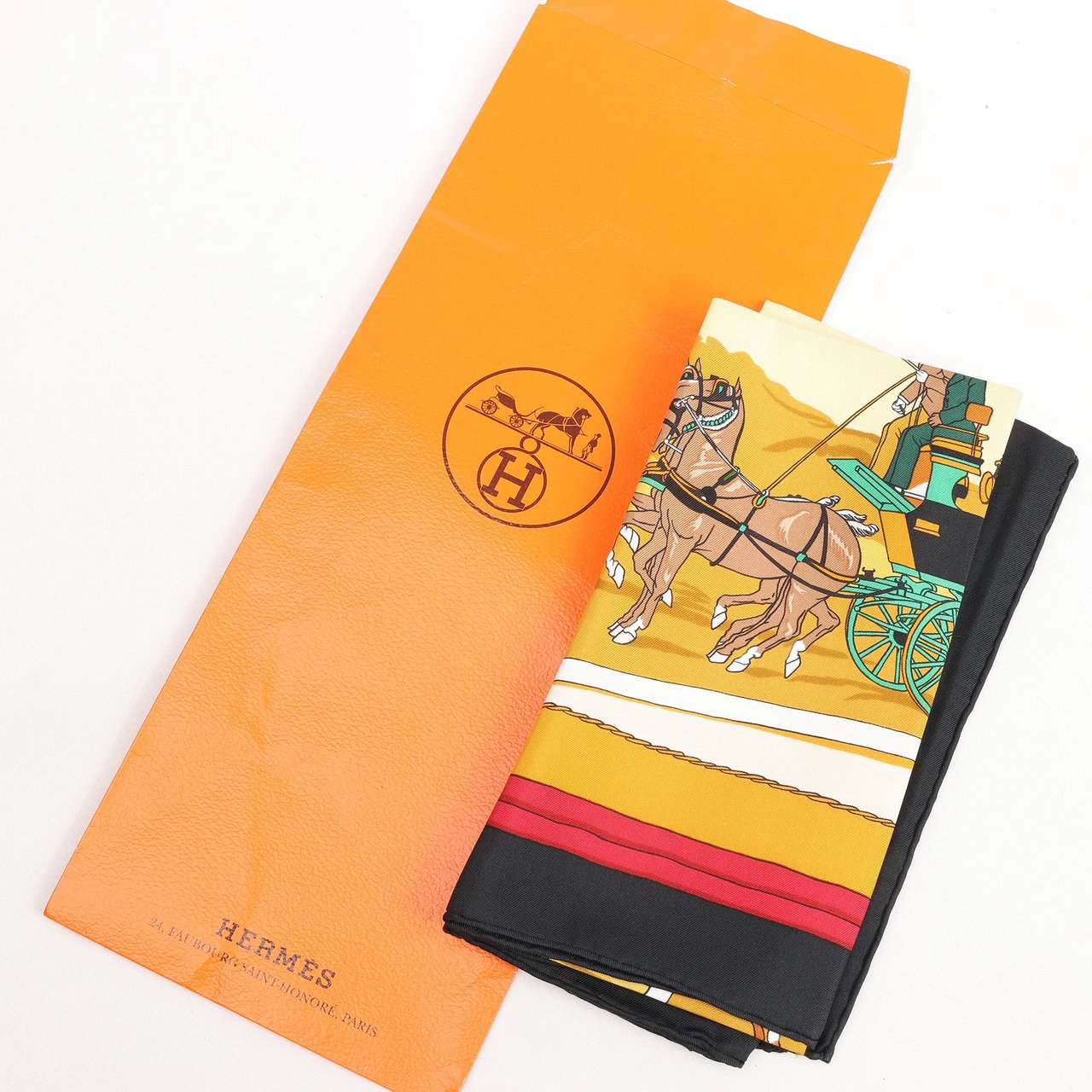 Hermès Hermès Carré 90 "Carriage and Hat" Silk handkerchief in Black x Orange Divers