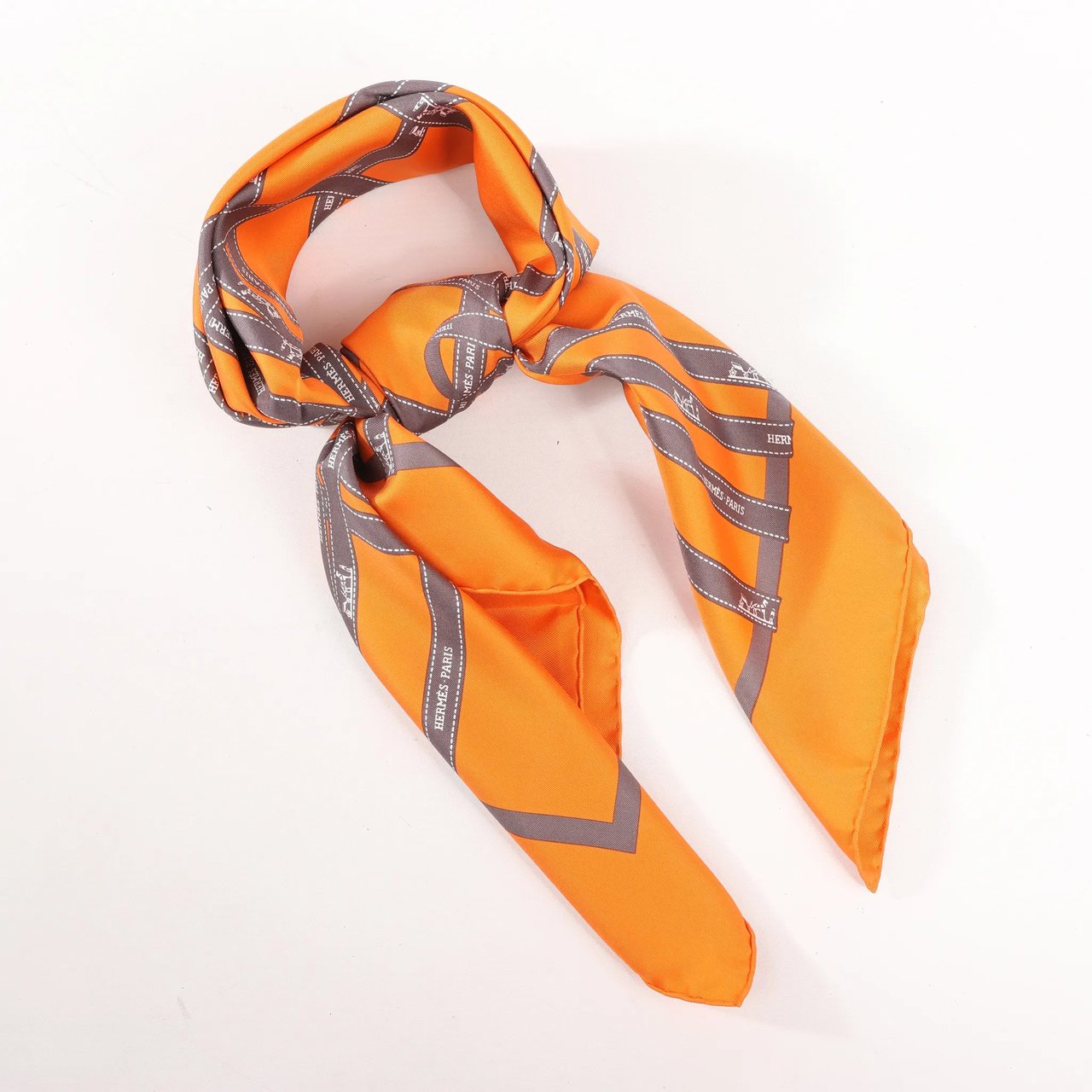 Hermès Hermès Carré 90 "Bolduc Ribbon" Silk handkerchief in Orange Oranje
