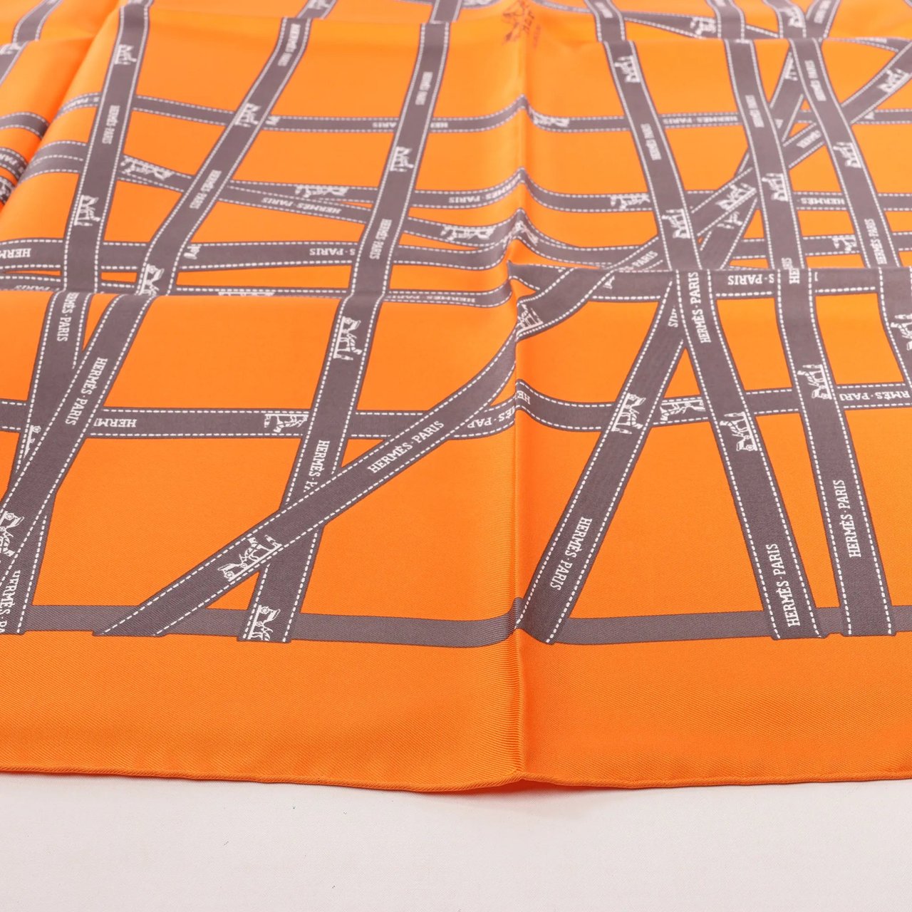 Hermès Hermès Carré 90 "Bolduc Ribbon" Silk handkerchief in Orange Oranje