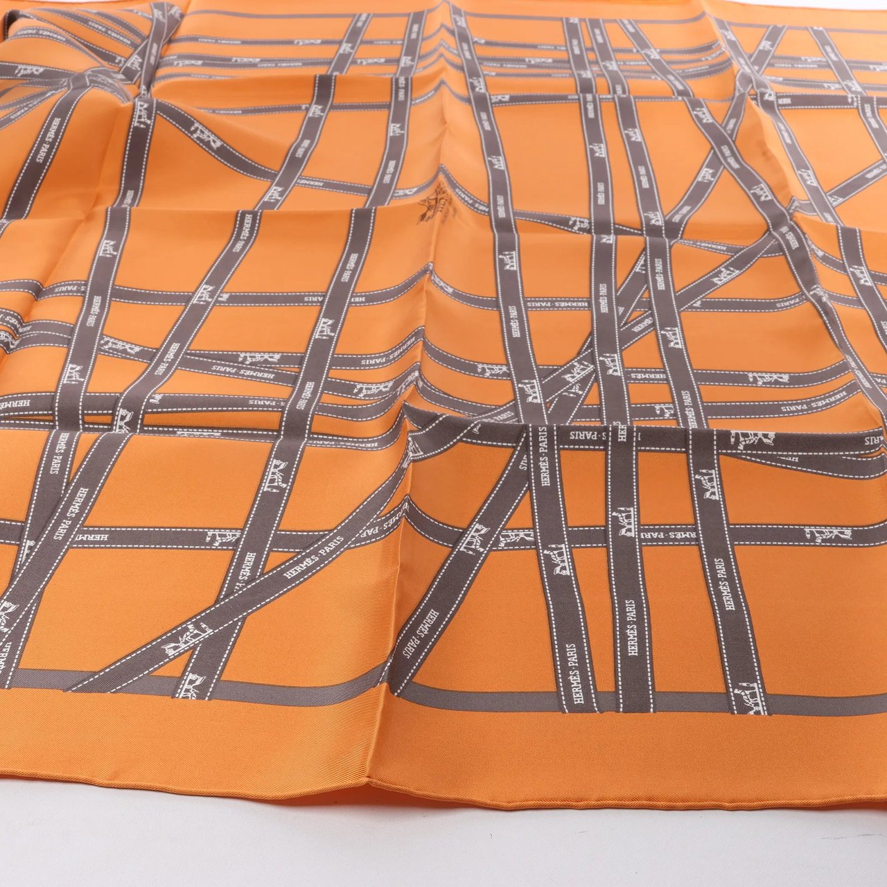 Hermès Hermès Carré 90 "Bolduc Ribbon" Silk handkerchief in Orange Oranje