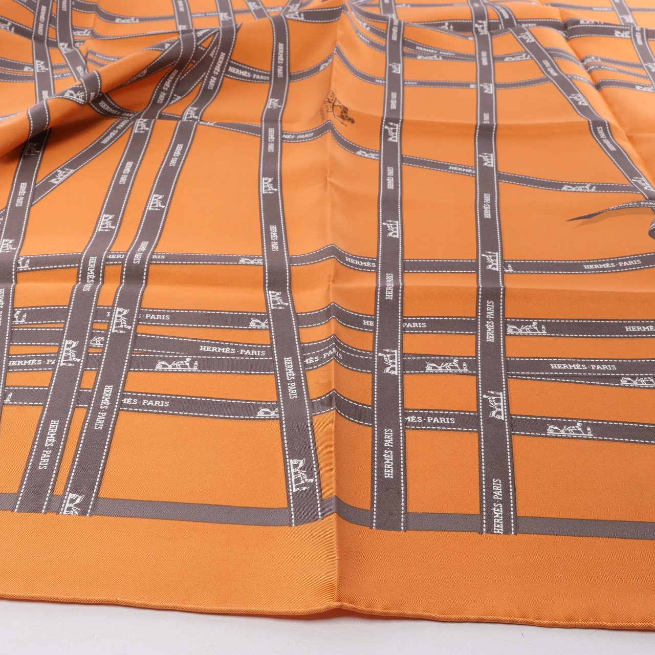 Hermès Hermès Carré 90 "Bolduc Ribbon" Silk handkerchief in Orange Oranje