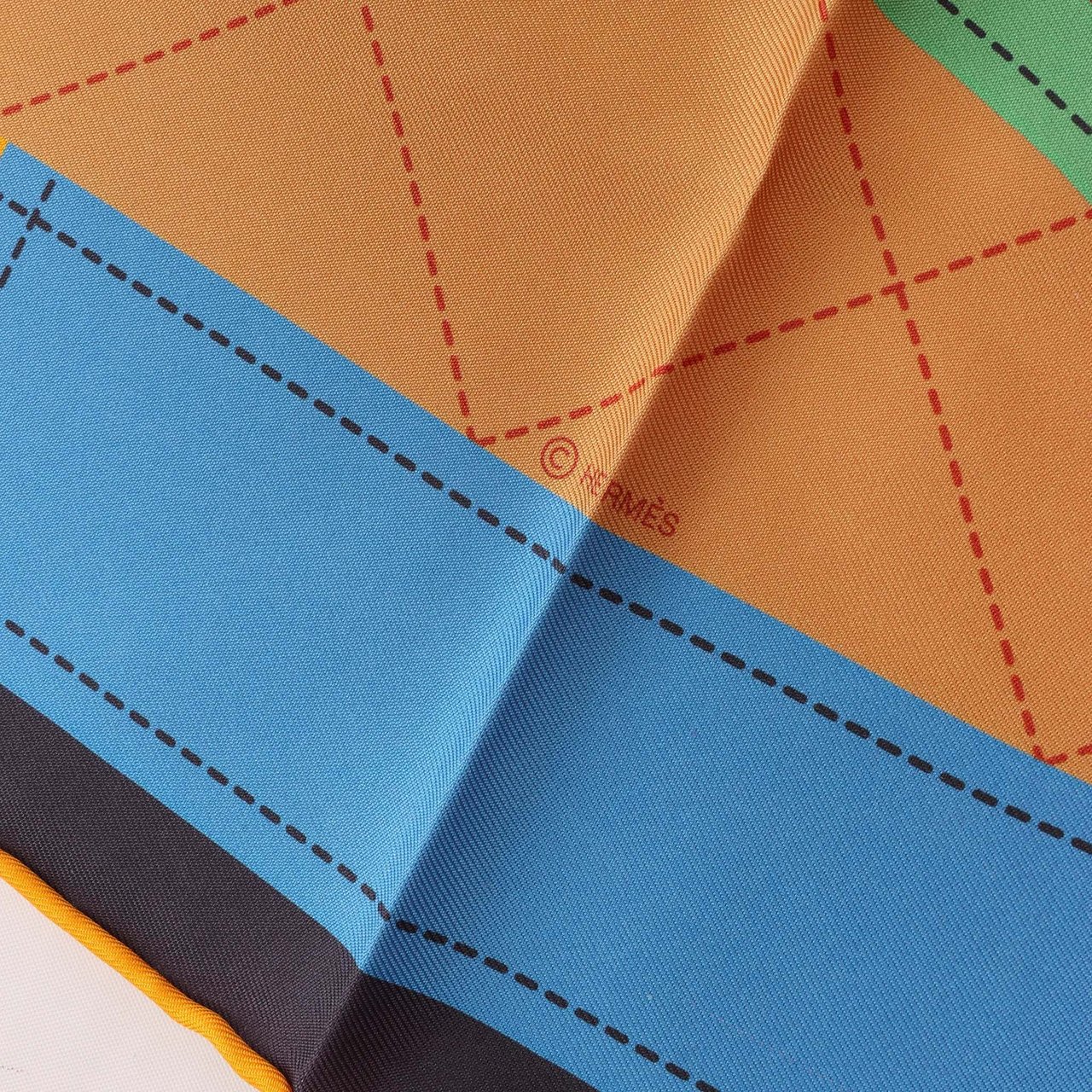 Hermès Carré 90 Double Face "Tapis de Selle" Silk handkerchief in Orange Oranje
