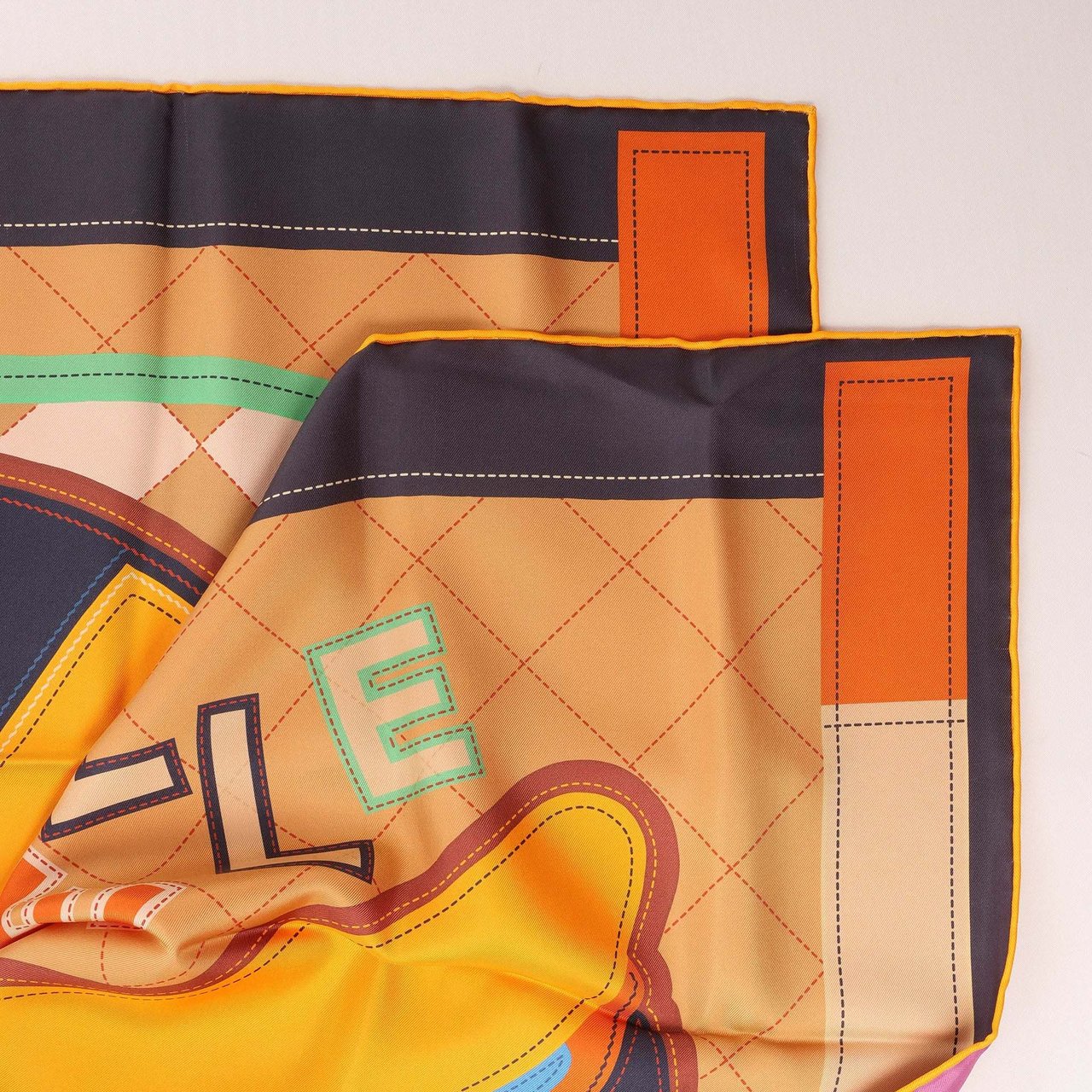 Hermès Carré 90 Double Face "Tapis de Selle" Silk handkerchief in Orange Oranje