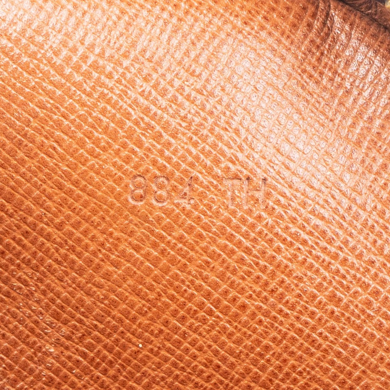 Louis Vuitton Louis Vuitton Canvas Monogram Marly Dragonne Clutch Bruin