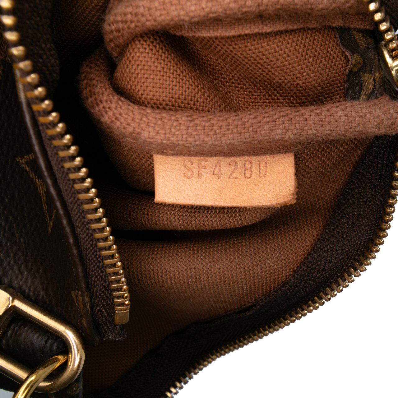 Louis Vuitton Monogram Mini Pochette Accessoires Bruin