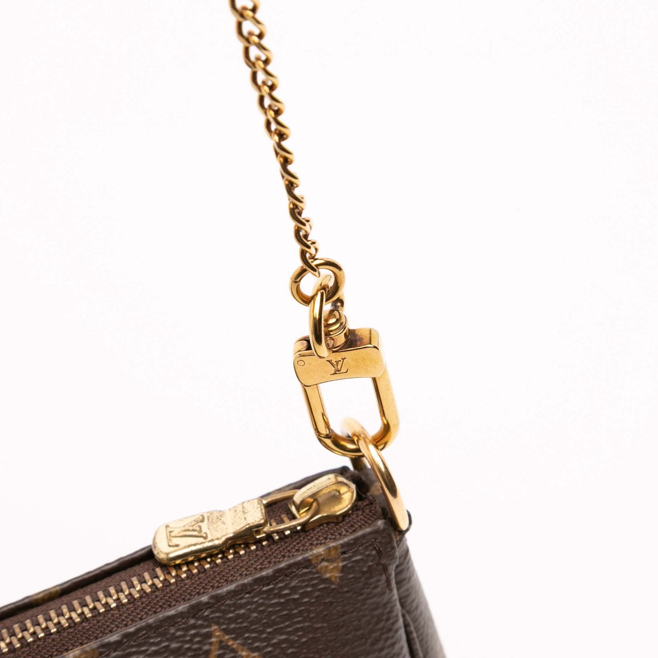 Louis Vuitton Monogram Mini Pochette Accessoires Bruin