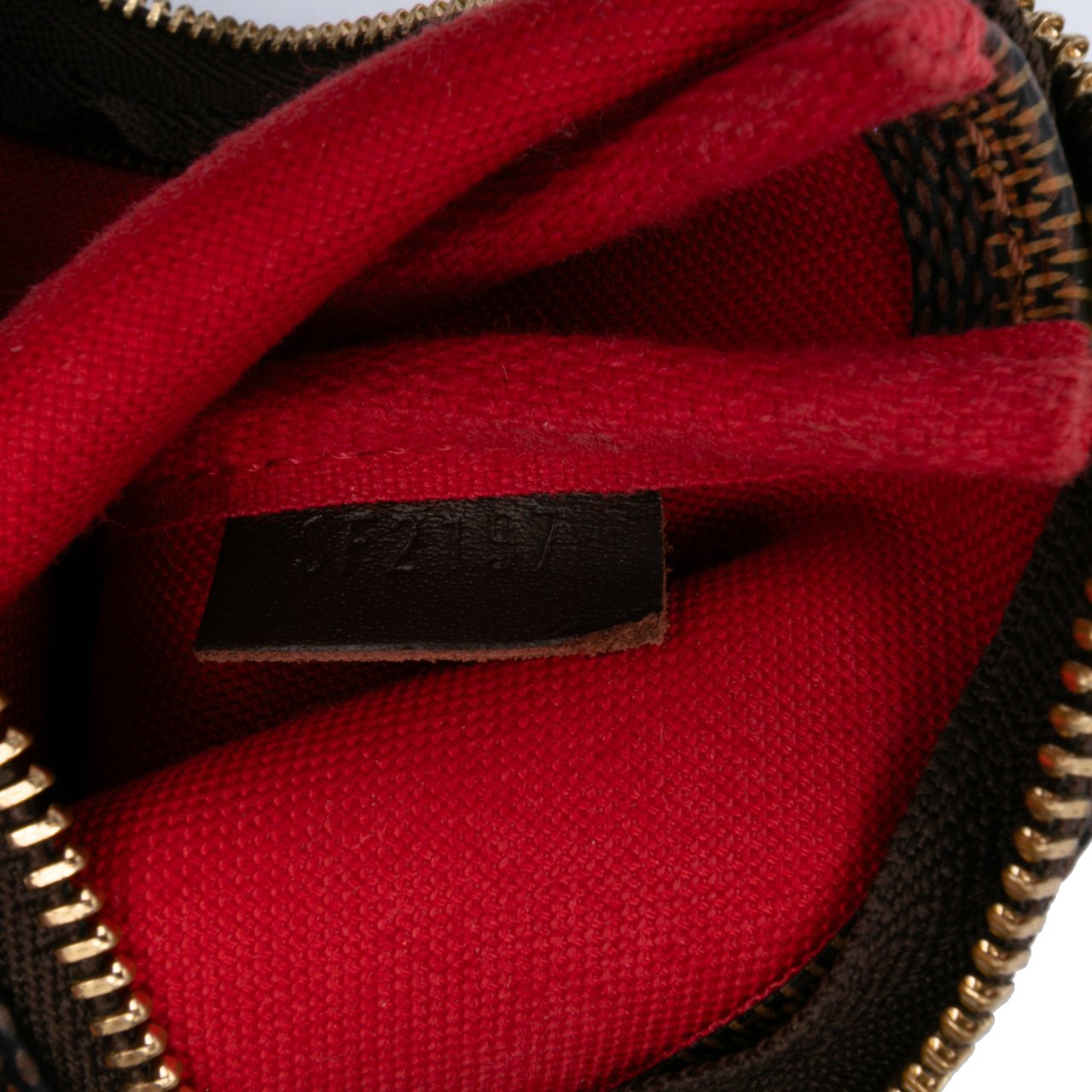 Louis Vuitton Damier Ebene Mini Pochette Accessoires Bruin