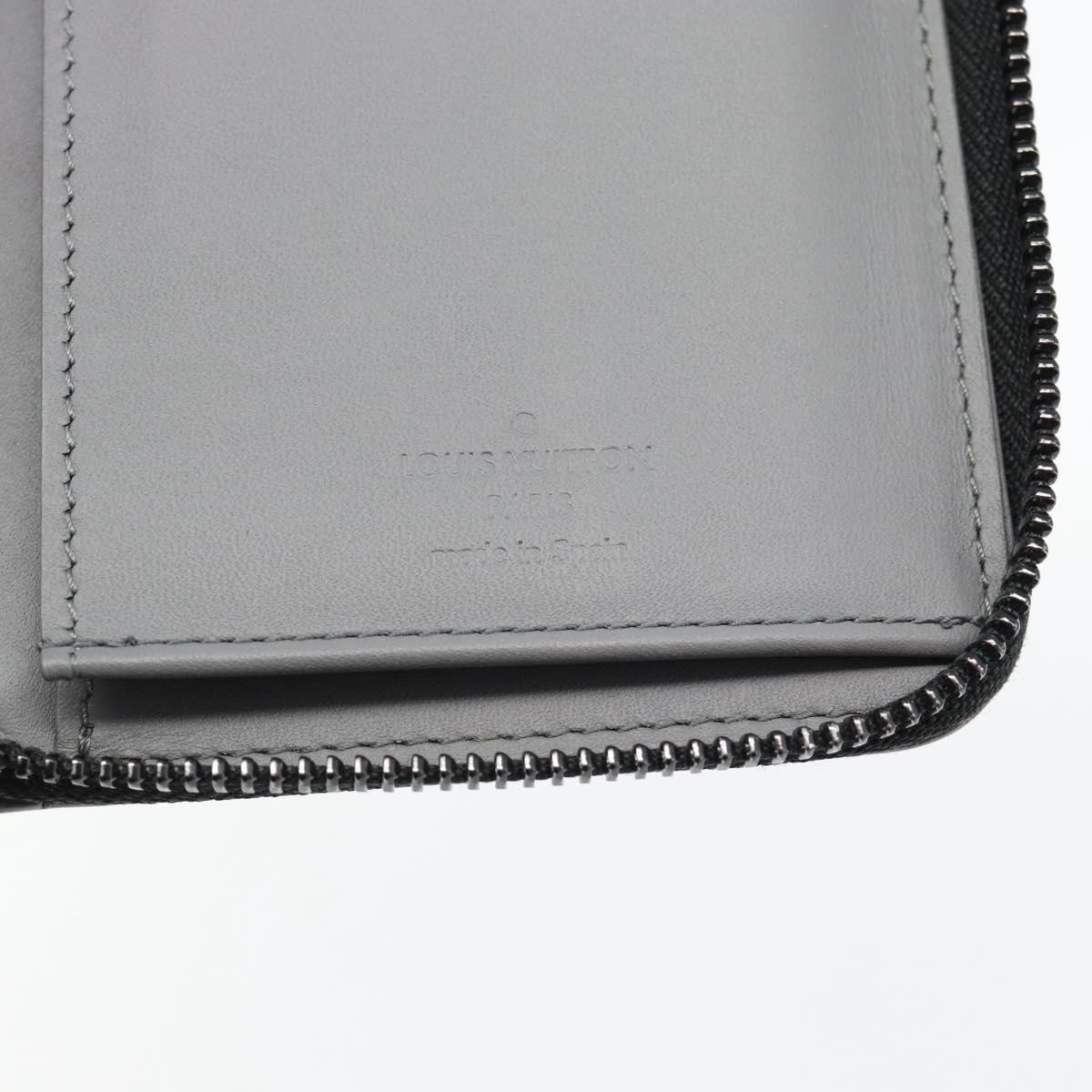 Louis Vuitton Zippy Wallet Vertical Monogram Shadow Leather Grijs