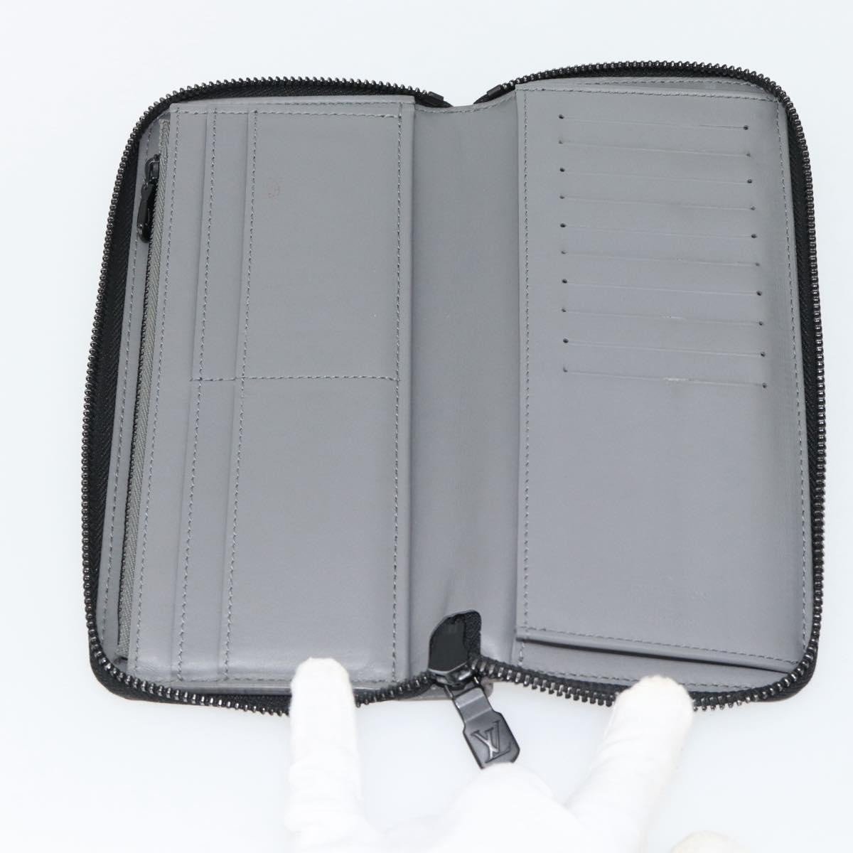 Louis Vuitton Zippy Wallet Vertical Monogram Shadow Leather Grijs
