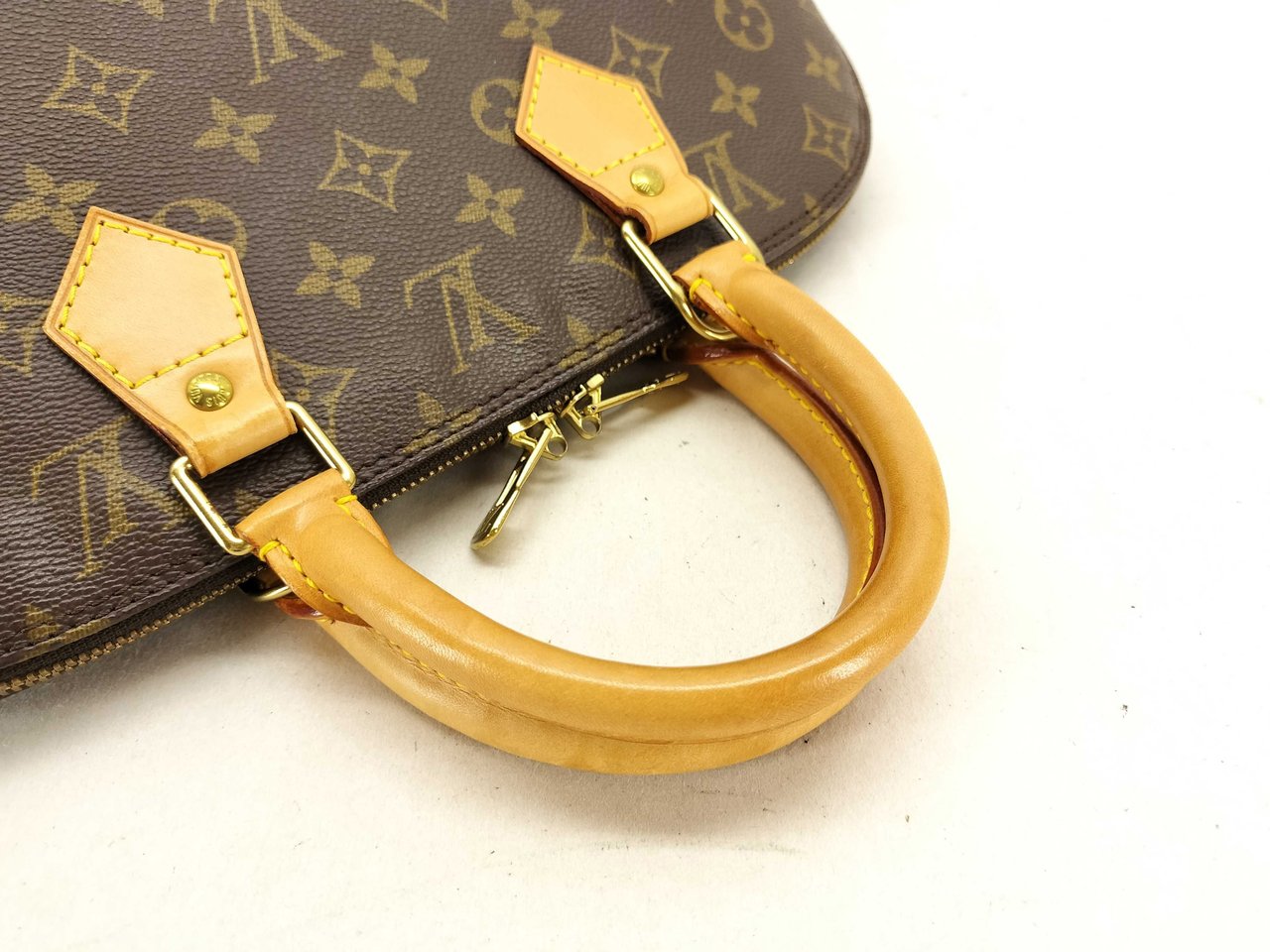 Louis Vuitton Alma Voyage Monogram Canvas MM Bruin