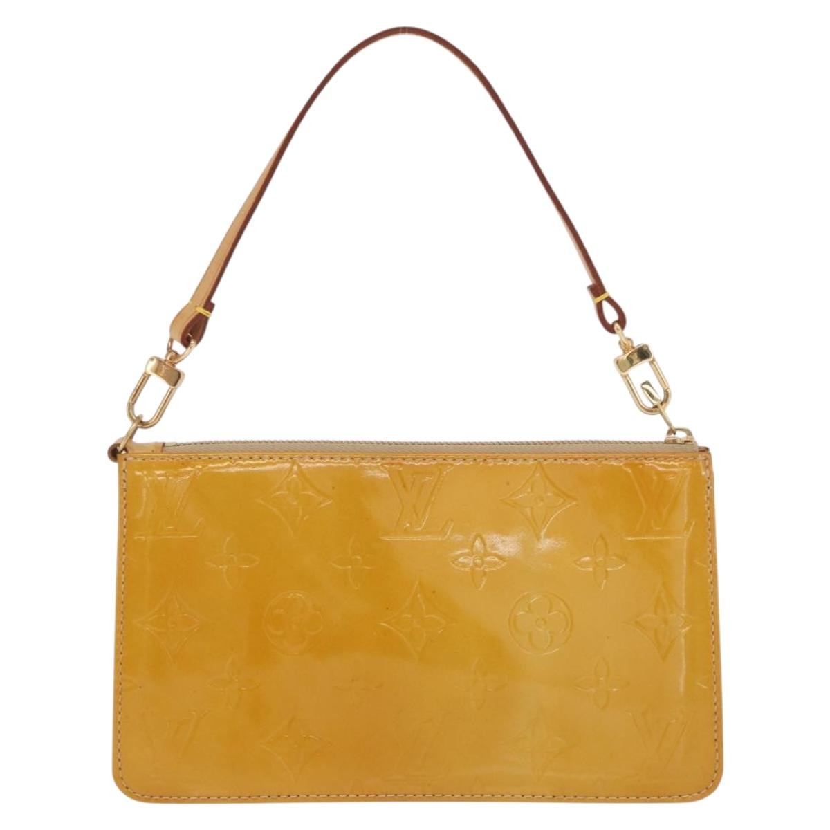 Louis Vuitton Lexington Pochette Patent Leather Geel