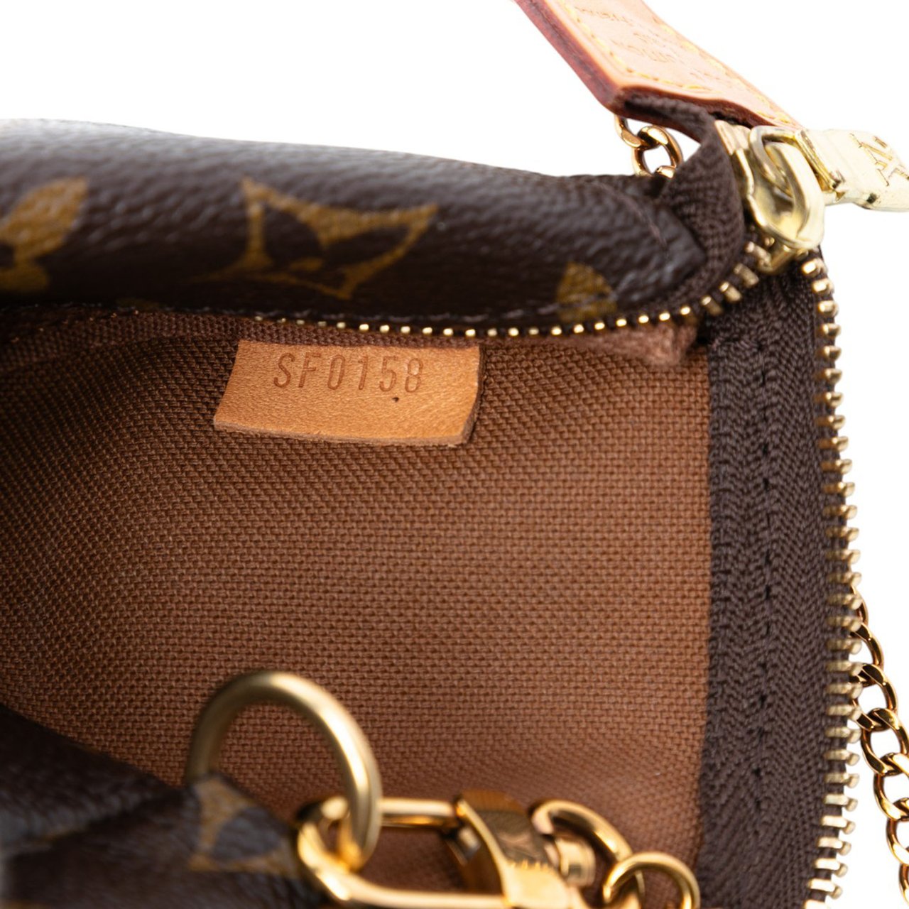 Louis Vuitton Monogram Mini Pochette Accessoires Bruin
