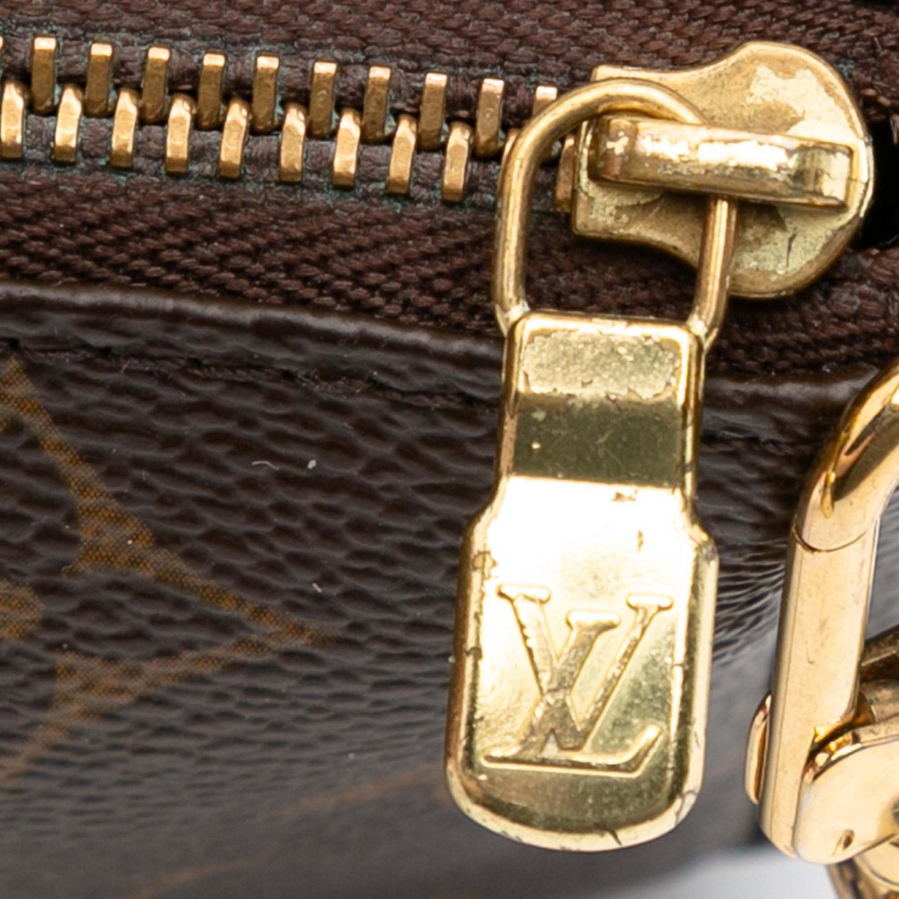 Louis Vuitton Monogram Mini Pochette Accessoires Bruin