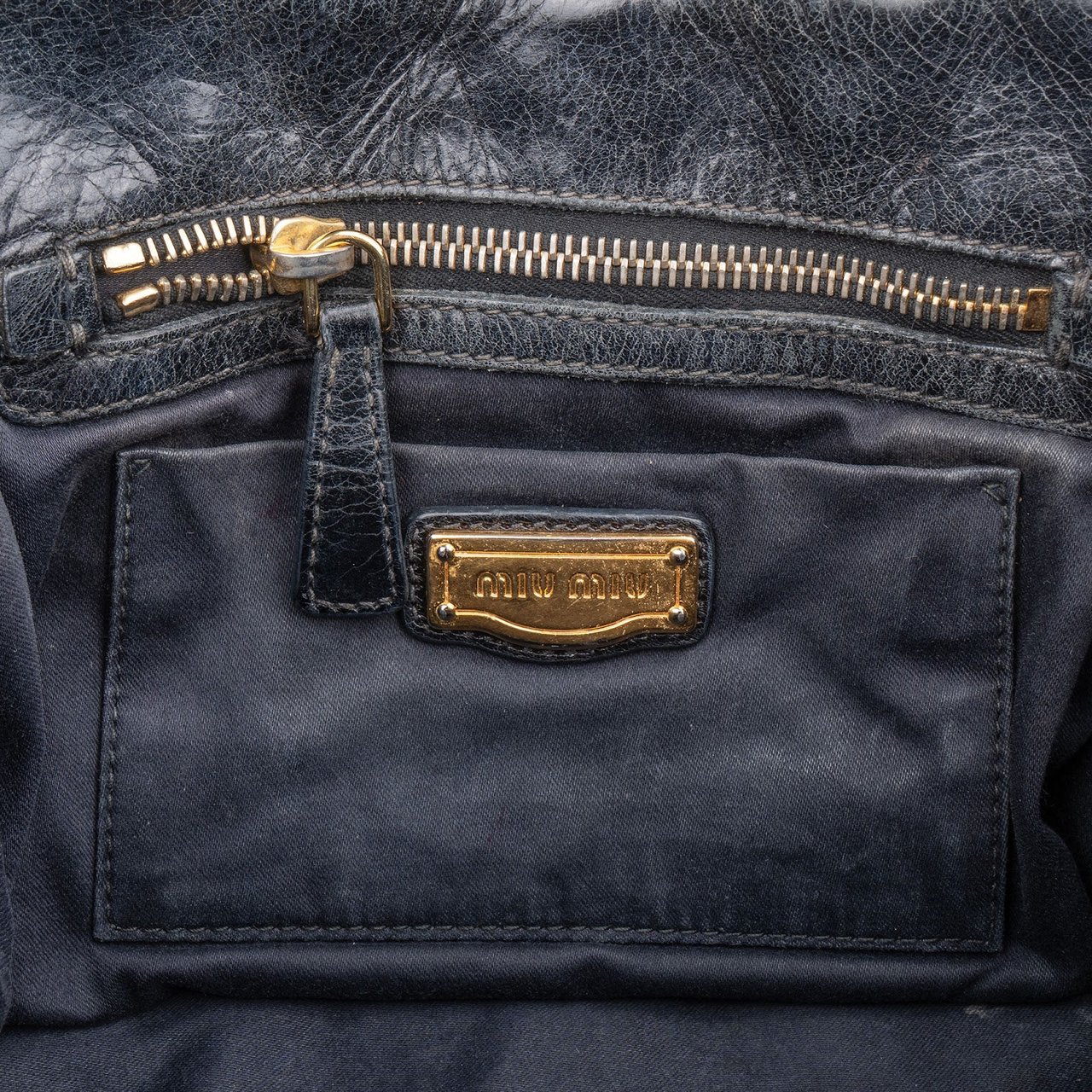 Miu Miu Quilted Leather Small City Handbag Zwart