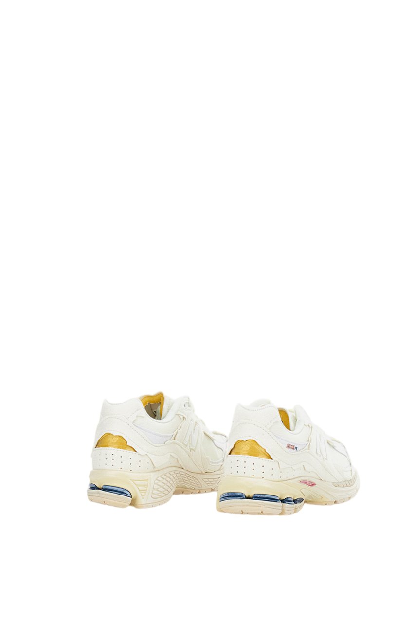 New Balance 2002R Protection Sneakers with Deconstructed Aesthetic Wit