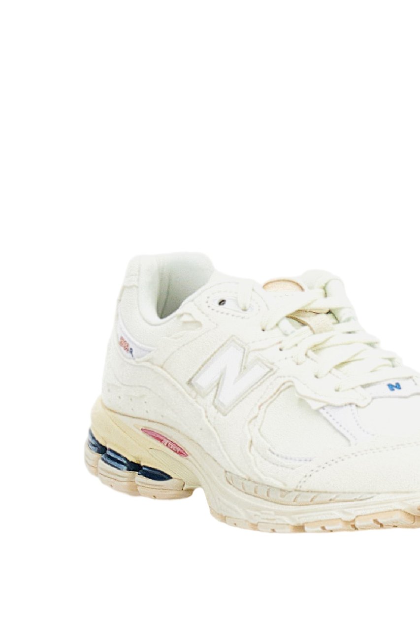 New Balance 2002R Protection Sneakers with Deconstructed Aesthetic Wit