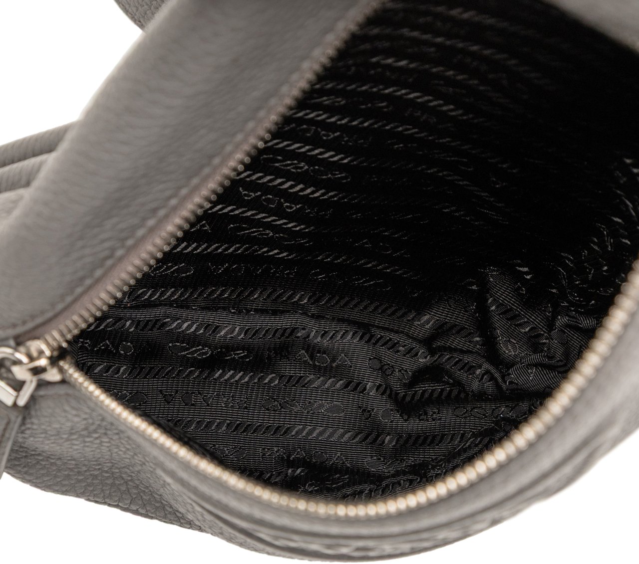 Prada Vitello Daino Logo Embossed Sling Bag Grijs