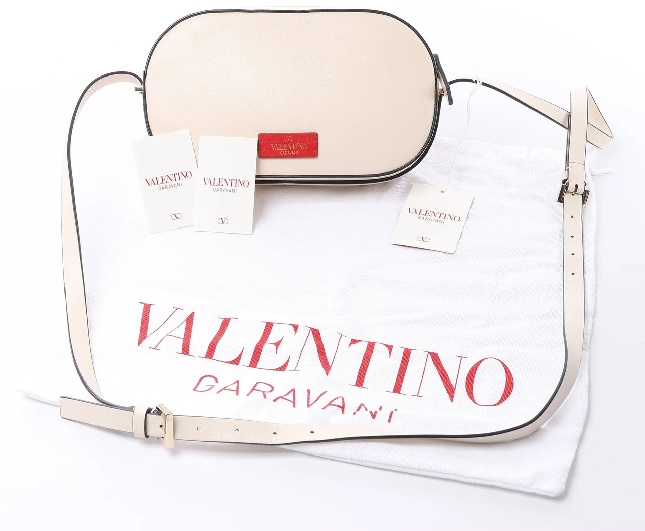Valentino Garavani V logo Leather Crossbody Bag in Pink Roze
