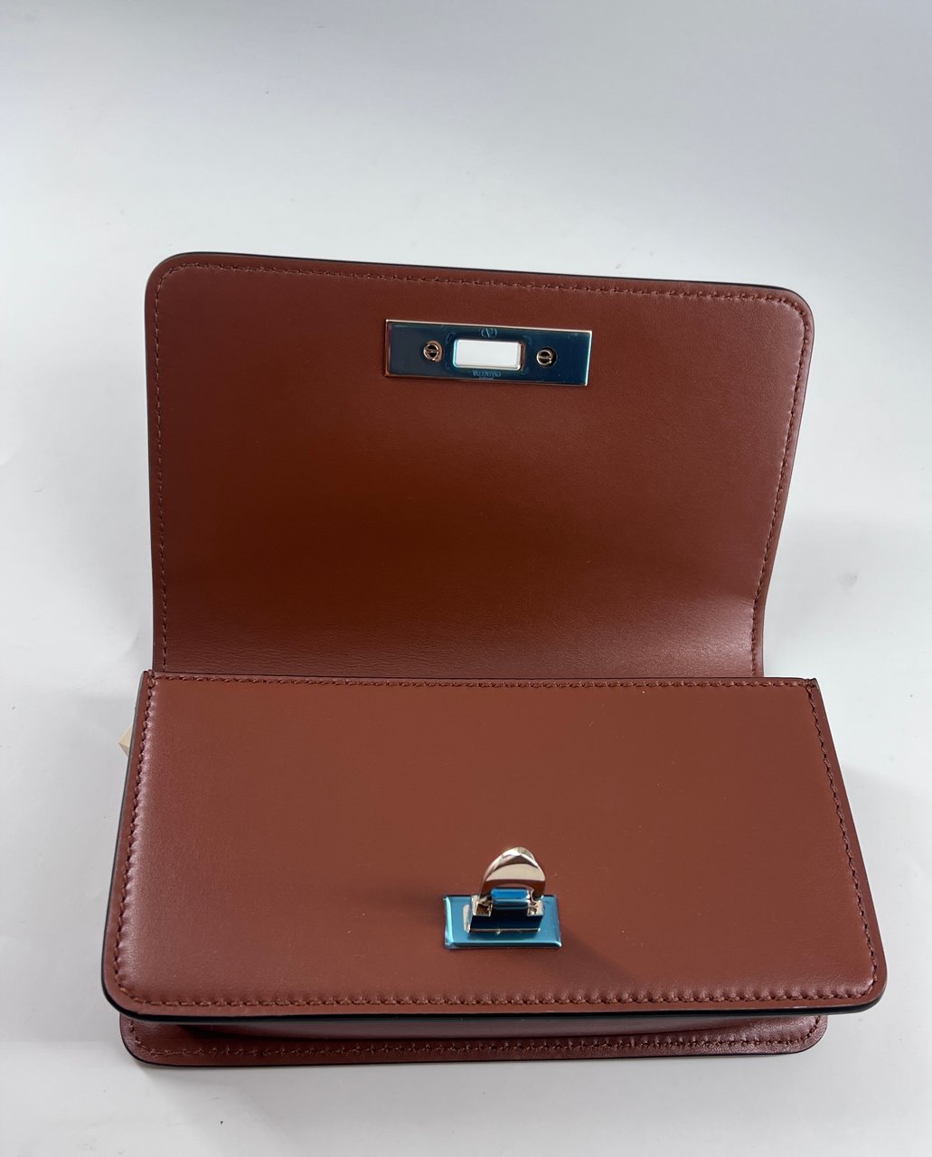 Valentino Garavani Valentino Garavani Rockstud Flip Lock Flap Bag Leather Small Bruin