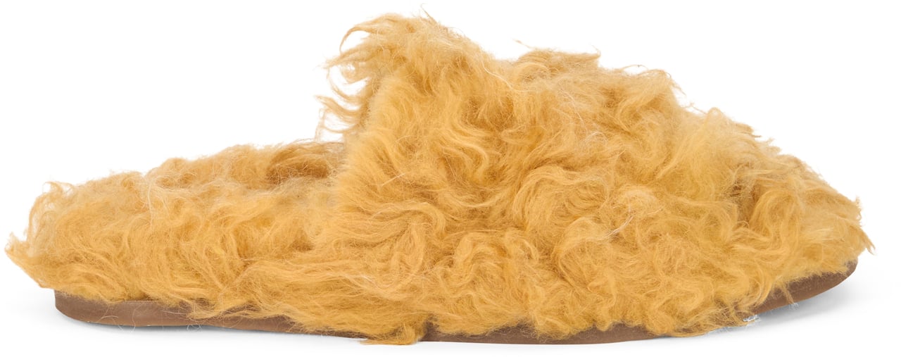 Valentino Low yellow mules with a modern and comfortable design. Geel