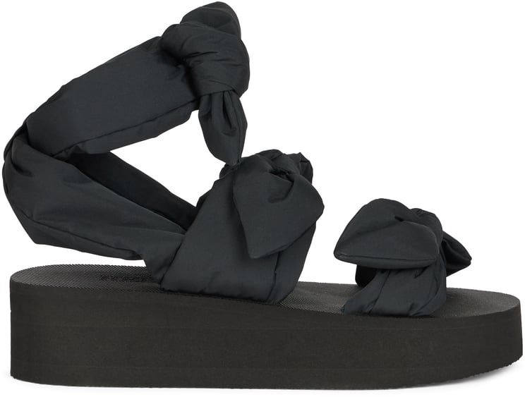 Valentino Modern black sandal with platform and wraparound strap.