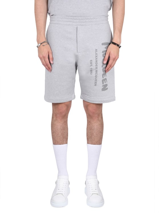 Alexander McQueen BERMUDA SHORTS WITH GRAFFITI LOGO PRINT