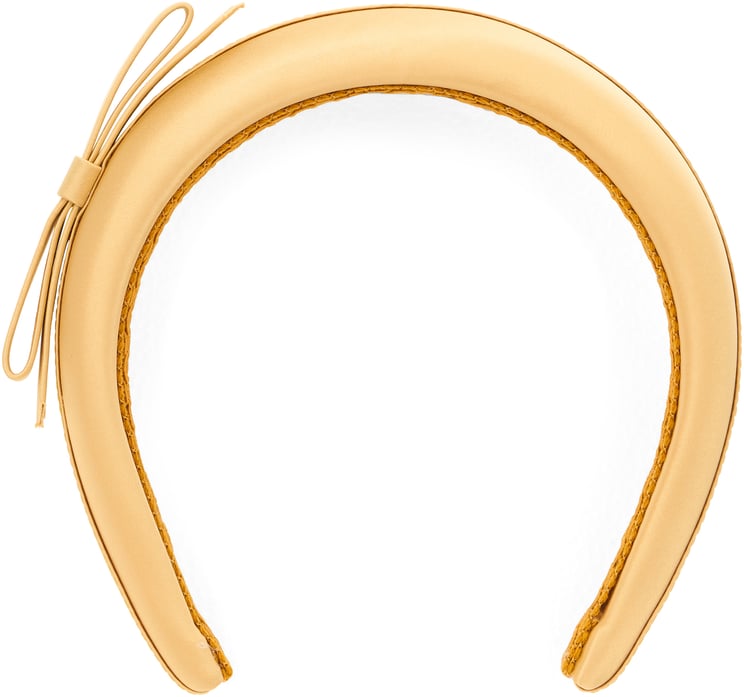 Valentino Yellow hairband with elegant and versatile design.