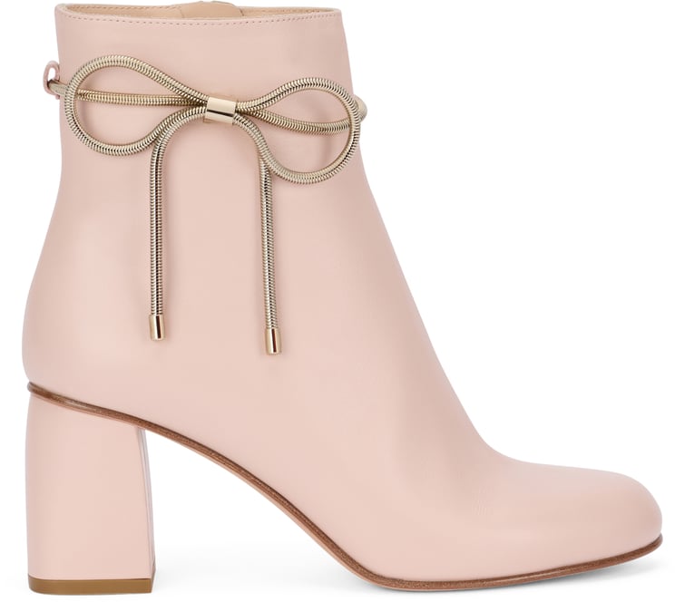 Valentino Ankle boots in pale pink color with mid heel.